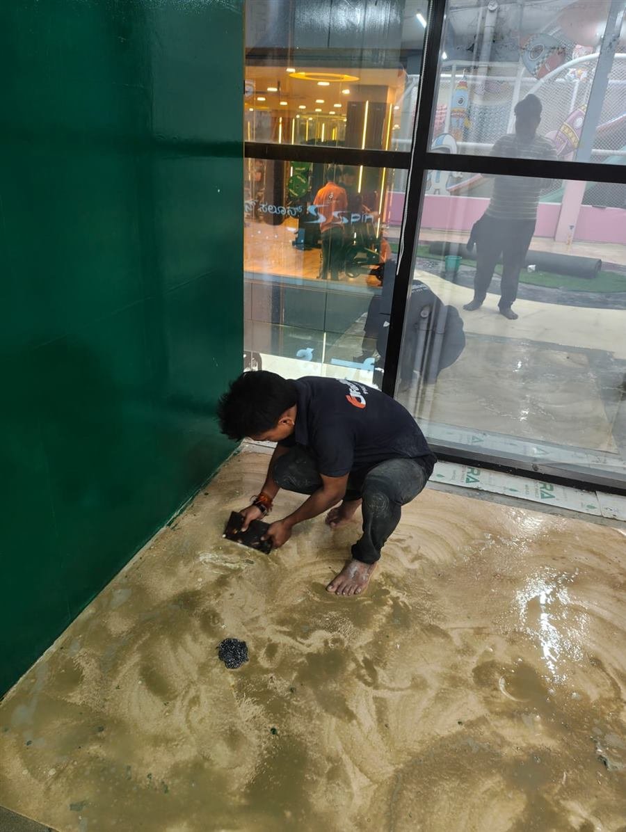 Scrubbing stains off the floor after interior work - Facilities4u Bangalore